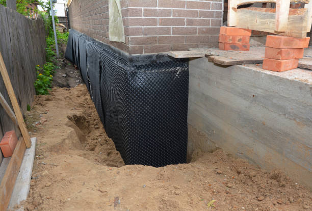 SJ Waterproofing Pros technician performing targeted Waterproofing assessment in Mark Center, OH